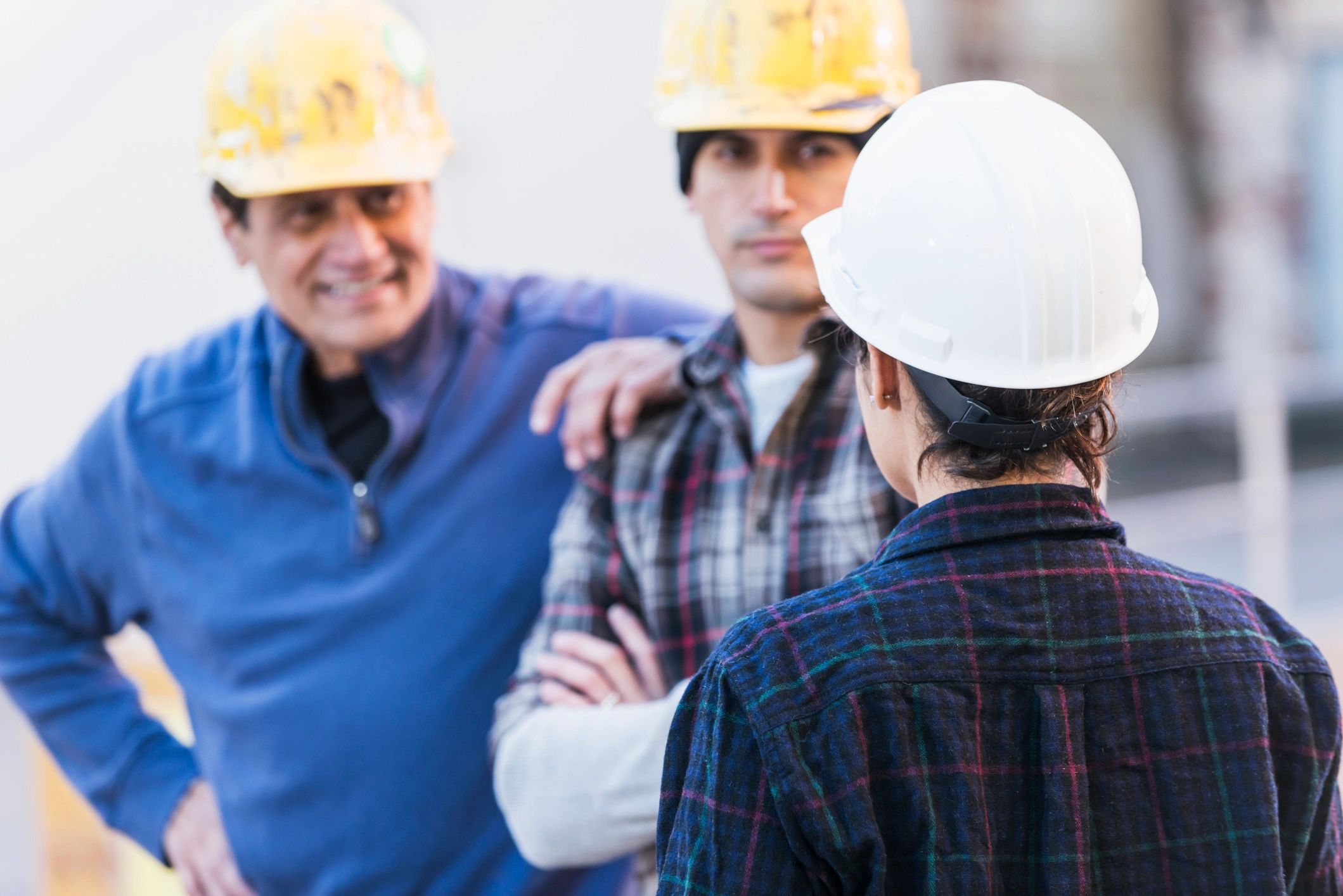Construction team reviewing plans together